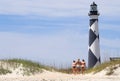 Girls by beach lighthouse Royalty Free Stock Photo