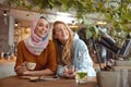 Girls. Beautiful Women Meeting In Cafe. Smiling Friends Drinking Coffee And Looking Away. Royalty Free Stock Photo