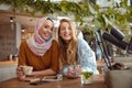 Girls. Beautiful Women Meeting In Cafe. Smiling Friends Drinking Coffee And Looking At Camera. Royalty Free Stock Photo