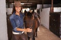 A girls best friend. a young woman tending to her horse. Royalty Free Stock Photo