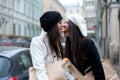 Girls biting one piece of french baguette