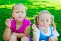 Girls blowing bubbles Royalty Free Stock Photo