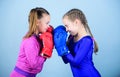 Girls in boxing sport. Boxer children in boxing gloves. Girls cute boxers on blue background. Friendship as battle and