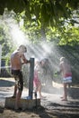 Girls and boy and hydrant fun Royalty Free Stock Photo