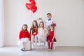 Girls and boy in red and white clothes on birthday party Royalty Free Stock Photo