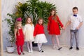 Girls and boy in red and white clothes on birthday party Royalty Free Stock Photo