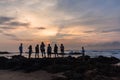 Girls Boys Family Silhouetted Beach Ocean Sunrise