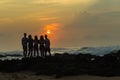 Girls Boys Silhouetted Beach Sunrise Ocean