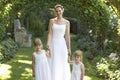 Girls And Bride Standing Under Ivy Arches