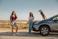 Girls with a broken a car on country road Royalty Free Stock Photo