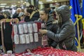 Girls buying martisoare to celebrate beginning of spring on Mar