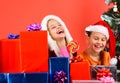 Girls celebrate New Year, have fun. Kids in Santa hats Royalty Free Stock Photo