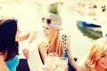 Girls with champagne glasses on boat Royalty Free Stock Photo