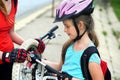 Girls children cycling Family pump up bicycle tire.