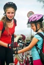 Girls children cycling Family pump up bicycle tire.