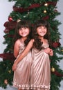 Girls by Christmas Tree