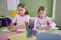 Girls in classroom doing schoolwork, writing Royalty Free Stock Photo