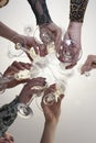 Girls clink glasses of sparkling wine at a festive party