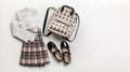 Girls clothes, primary or elementary school uniform, white blouse and plaid skirt