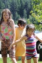 Elementary aged girls in a cold sprinkler Royalty Free Stock Photo