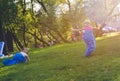 Girls compete in a relay race . Jumping in bags . They laugh and fall . Royalty Free Stock Photo