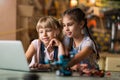 Girls cooperating while making a robot Royalty Free Stock Photo