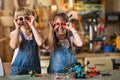 Girls cooperating while making a robot Royalty Free Stock Photo