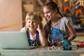 Girls cooperating while making a robot Royalty Free Stock Photo