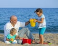 Girls with dad at sea Royalty Free Stock Photo