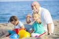 Girls with dad on sea shore Royalty Free Stock Photo