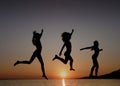 Girls dancing in sunset