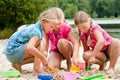 The girls digging in the sand