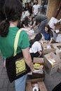 Girls disassemble boxes with humanitarian aid for the army