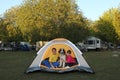 Girls and Dog in a Tent While Camping Royalty Free Stock Photo