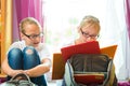 Girls doing homework and packing school bags Royalty Free Stock Photo