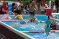 Girls Doing Water Aerobics with Floating Pool Dumbbells Outdoor in a Swimming Pool