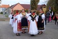 Girls dressed in folk costumes go to the church at the Mass on Thanksgiving day in Stitar, Croatia