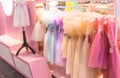 Girls` dresses are hung on shelves in children`s clothing stores. Lovely dresses for girls on birthdays, holiday, competitions,.. Royalty Free Stock Photo