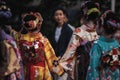 Girls dressing maiko clothes up and on the way to have a performance.