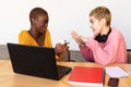 Girls drinking coffee and shopping online on laptop Royalty Free Stock Photo