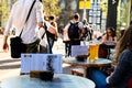 Girls drinking cold light beer in street cafe in Amsterdam