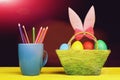 Girls Easter bunny ears in pink colour standing in basket Royalty Free Stock Photo