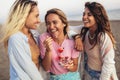 Girls Eating Ice Cream On The Beach