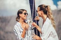 Girls enjoy the vacation on a yacht. Royalty Free Stock Photo