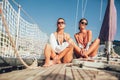 Girls enjoy the vacation on a yacht. Royalty Free Stock Photo