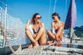 Girls enjoy the vacation on a yacht. Royalty Free Stock Photo