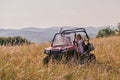 girls enjoying a beautiful sunny day while driving an off-road car Royalty Free Stock Photo