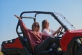 girls enjoying a beautiful sunny day while driving an off-road car Royalty Free Stock Photo