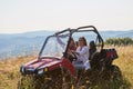 girls enjoying a beautiful sunny day while driving an off-road car Royalty Free Stock Photo