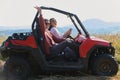 girls enjoying a beautiful sunny day while driving an off-road car Royalty Free Stock Photo